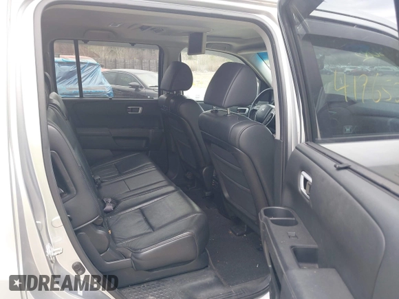 2011 Honda Pilot Touring with VIN 5FNYF4H90BB022354, listed as a IAAI auction lot 41965082 with 126,505 mi miles and . Bid and sale history available at carsss.com. Image 8.