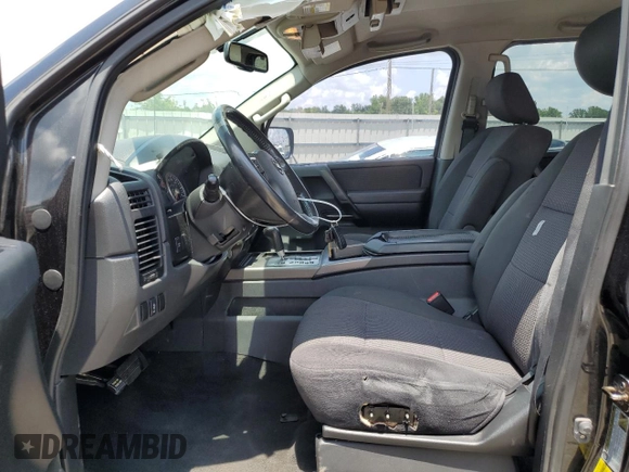 2012 Nissan Titan SV with VIN 1N6BA0ED1CN323589, listed as a Copart auction lot 62068904 with 148,354 mi miles and Salvage Title. Bid and sale history available at DreamBid. Image 7.