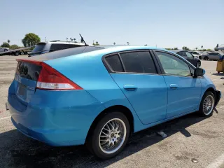 2010 Honda Insight LX with VIN JHMZE2H51AS028849, listed as a Copart auction lot 65547805 with 209,316 mi miles and Salvage title. Bid and sale history available at DreamBid. Image 3.
