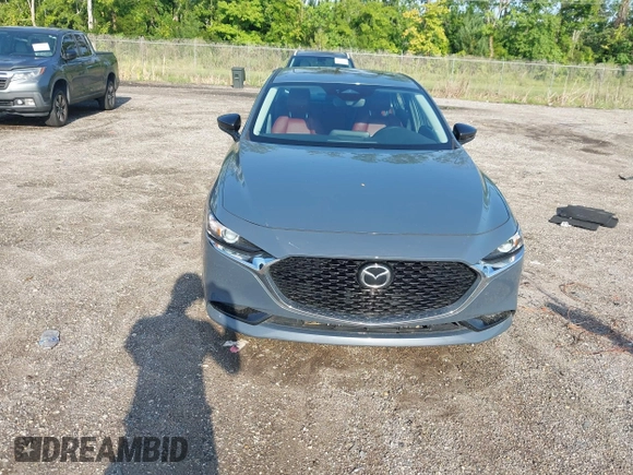 2024 Mazda 3 S Carbon Edition with VIN 3MZBPBCM6RM411828, listed as a IAAI auction lot 42802141 with 40,061 mi miles and . Bid and sale history available at DreamBid. Image 17.
