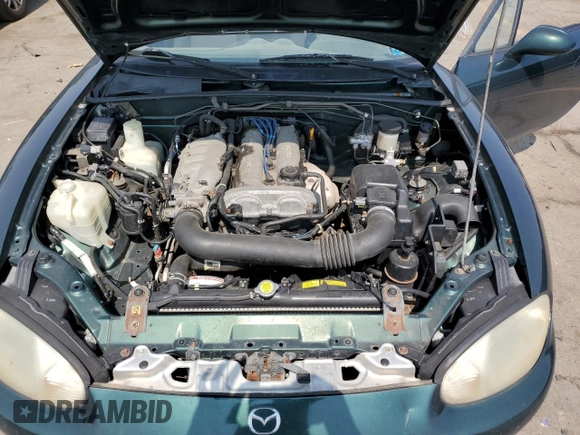 2000 Mazda MX-5 Miata with VIN JM1NB3533Y0151883, listed as a Copart auction lot 64423925 with 180,275 mi miles and Salvage title. Bid and sale history available at DreamBid. Image 11.