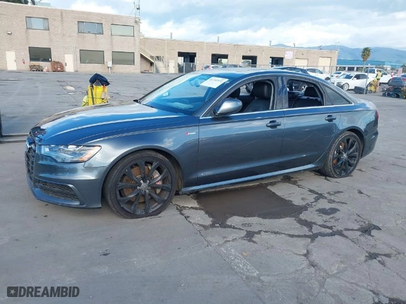2014 Audi A6 3.0T Prestige with VIN WAUHGAFC7EN036961, listed as a IAAI auction lot 41741972 with 113,642 mi miles. Bid and sale history available at carsss.com. Image 2.