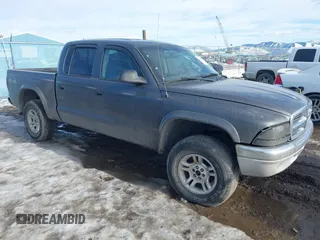 2004 Dodge Dakota SLT with VIN 1D7HG48N44S701906, listed as a IAAI auction lot 41662483 with 202,575 mi miles. Bid and sale history available at carsss.com. Image 1.