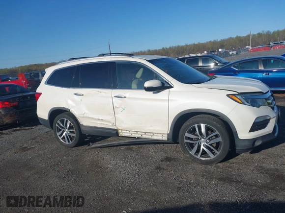 2017 Honda Pilot Elite with VIN 5FNYF6H00HB032386, listed as a IAAI auction lot 41976702 with 153,251 mi miles and . Bid and sale history available at DreamBid. Image 13.