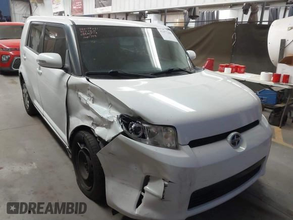 2014 Scion xB with VIN JTLZE4FE1EJ060281, listed as a IAAI auction lot 41477386 with 61,423 mi miles. Bid and sale history available at carsss.com. Image 1.