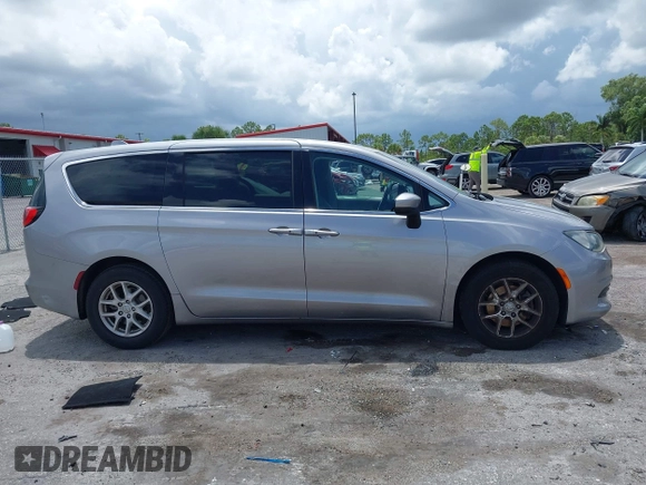 2017 Chrysler Pacifica Touring with VIN 2C4RC1DG7HR516711, listed as a IAAI auction lot 42633544 with 97,853 mi miles and . Bid and sale history available at DreamBid. Image 13.