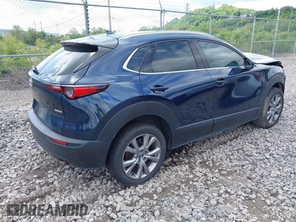 2021 Mazda CX-30 Premium z VIN 3MVDMBDL7MM236474, wystawiony jako IAAI lot #42284515 z przebiegiem 58 565 mil mil oraz . Historia ofert i sprzedaży dostępna na DreamBid. Obrazek 4.