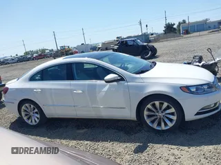 2013 Volkswagen CC Lux z VIN WVWHU7AN1DE500722, wystawiony jako IAAI lot #42072779 z przebiegiem 188 987 mil mil oraz . Historia ofert i sprzedaży dostępna na DreamBid. Obrazek 13.