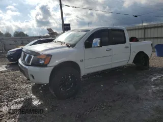 2004 Nissan Titan SE with VIN 1N6AA07A74N504082, listed as a Copart auction lot 80674704 with 213,649 mi miles and Salvage title. Bid and sale history available at DreamBid. Image 1.