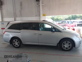 2012 Honda Odyssey EX-L with VIN 5FNRL5H67CB005013, listed as a IAAI auction lot 42295586 with 200,611 mi miles and . Bid and sale history available at DreamBid. Image 13.