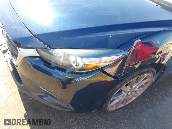 2018 Mazda 3 Touring z VIN 3MZBN1L36JM238646, wystawiony jako IAAI lot #41376772 z przebiegiem 97 261 mil mil oraz . Historia ofert i sprzedaży dostępna na DreamBid. Obrazek 17.
