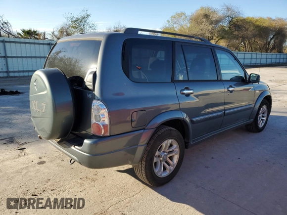 2005 Suzuki XL7 LX z VIN JS3TY92V554107839, wystawiony jako Copart lot #88328455 z przebiegiem 122 912 mil mil oraz Szkoda całkowita • Salvage title. Historia ofert i sprzedaży dostępna na DreamBid. Obrazek 3.