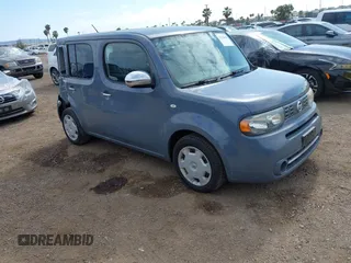 2014 Nissan Cube SL z VIN JN8AZ2KR5ET353443, wystawiony jako IAAI lot #42128618 z przebiegiem 61 310 mil mil oraz . Historia ofert i sprzedaży dostępna na DreamBid. Obrazek 1.