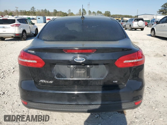 2017 Ford Focus SE with VIN 1FADP3F26HL331253, listed as a Copart auction lot 50869865 with 60,776 mi miles and Salvage title. Bid and sale history available at DreamBid. Image 6.
