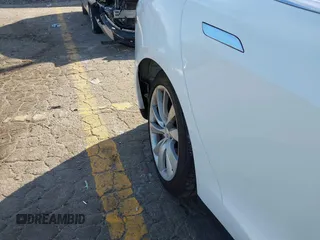 2014 Tesla Model S 60 with VIN 5YJSA1H13EFP62451, listed as a IAAI auction lot 41639068 with 88,000 mi miles and . Bid and sale history available at DreamBid. Image 20.