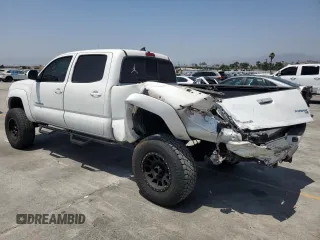 2014 Toyota Tacoma PreRunner with VIN 3TMKU4HN8EM041212, listed as a Copart auction lot 61948125 with 83,601 mi miles and Salvage title. Bid and sale history available at DreamBid. Image 2.