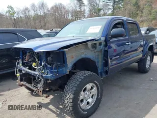 2014 Toyota Tacoma with VIN 3TMLU4EN0EM153558, listed as a IAAI auction lot 41964890 with 140,864 mi miles and . Bid and sale history available at DreamBid. Image 2.