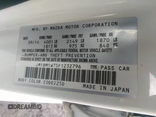 2015 Mazda 3 i Grand Touring z VIN JM1BM1W75F1232796, wystawiony jako IAAI lot #39976305 z przebiegiem 69 161 mil mil oraz . Historia ofert i sprzedaży dostępna na DreamBid. Obrazek 9.