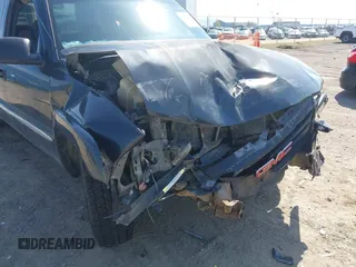 2003 GMC Sierra 1500 SLT z VIN 1GTEK19T03E191705, wystawiony jako IAAI lot #42145392 z przebiegiem Nie podano mil oraz . Historia ofert i sprzedaży dostępna na DreamBid. Obrazek 6.