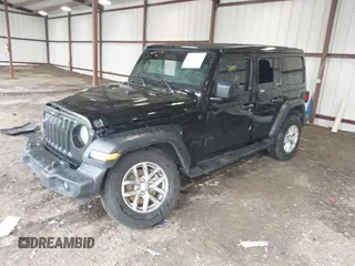 2023 Jeep Wrangler Willys with VIN 1C4HJXDG0PW617101, listed as a IAAI auction lot 42111687 with 56,415 mi miles and . Bid and sale history available at DreamBid. Image 2.