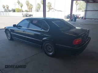 1999 BMW 7 Series 740il with VIN WBAGH8336XDP03839, listed as a IAAI auction lot 42067133 with 163,345 mi miles. Bid and sale history available at carsss.com. Image 3.