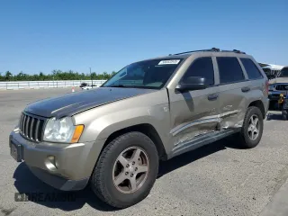 2005 Jeep Grand Cherokee Laredo with VIN 1J4HR48N55C731992, listed as a Copart auction lot 58052845 with 175,195 mi miles and Salvage title. Bid and sale history available at DreamBid. Image 1.