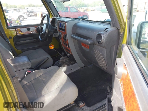 2007 Jeep Wrangler Unlimited Sahara with VIN 1J4GA59177L182593, listed as a IAAI auction lot 42104934 with 158,990 mi miles and . Bid and sale history available at DreamBid. Image 5.