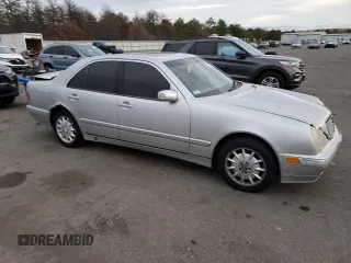 2000 Mercedes-Benz E-Class with VIN WDBJF65J8YB153103, listed as a Copart auction lot 80986234 with 144,205 mi miles and Salvage Title. Bid and sale history available at carsss.com. Image 4.