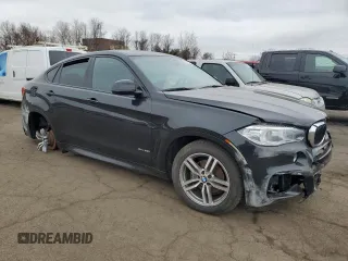 2019 BMW X6 xDrive35i with VIN 5UXKU2C5XK0Z62856, listed as a Copart auction lot 49813375 with 87,183 mi miles and Salvage Title. Bid and sale history available at carsss.com. Image 4.