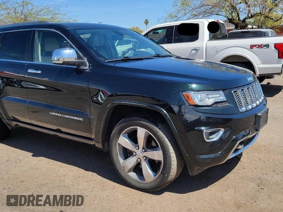 2014 Jeep Grand Cherokee Overland with VIN 1C4RJFCT7EC187319, listed as a Copart auction lot 55284615 with 98,314 mi miles and Clean Title. Bid and sale history available at DreamBid. Image 1.