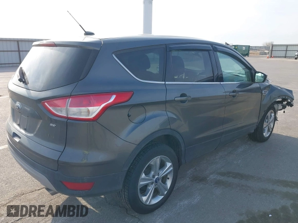 2015 Ford Escape SE with VIN 1FMCU0G73FUA77673, listed as a IAAI auction lot 41988290 with 176,734 mi miles. Bid and sale history available at carsss.com. Image 4.