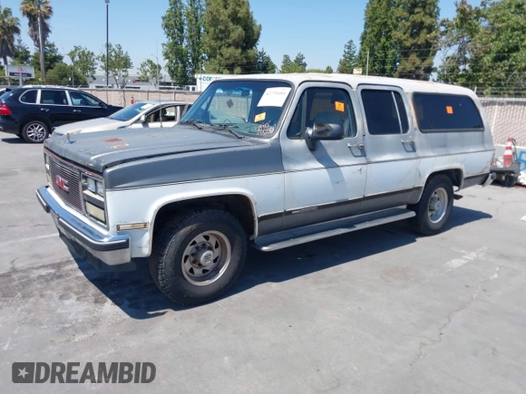 1990 GMC Suburban with VIN 1GKGR26NXLF528203, listed as a IAAI auction lot 42731684 with 185,736 mi miles and . Bid and sale history available at DreamBid. Image 6.