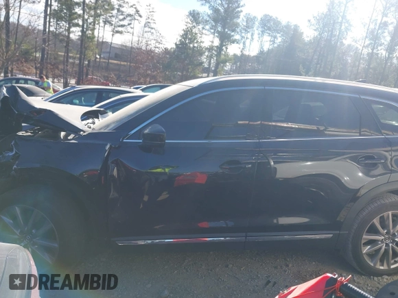 2020 Mazda CX-9 Grand Touring with VIN JM3TCADY8L0405173, listed as a IAAI auction lot 41701533 with 58,119 mi miles and . Bid and sale history available at DreamBid. Image 14.