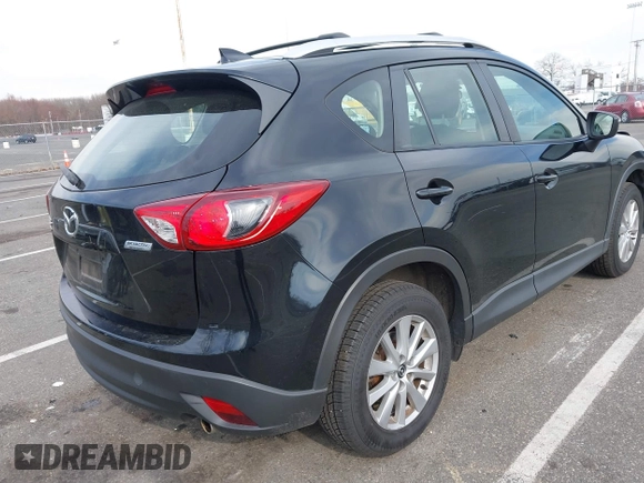 2016 Mazda CX-5 Sport with VIN JM3KE4BY7G0893578, listed as a IAAI auction lot 41853840 with 95,937 mi miles. Bid and sale history available at carsss.com. Image 4.