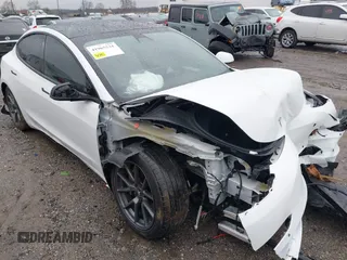 2022 Tesla Model 3 Long Range with VIN 5YJ3E1EB0NF129945, listed as a IAAI auction lot 41965531 with 59,162 mi miles and . Bid and sale history available at DreamBid. Image 1.