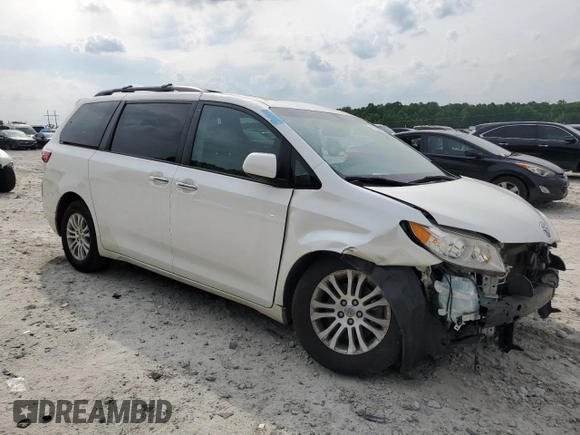 2016 Toyota Sienna XLE with VIN 5TDYK3DC3GS730639, listed as a Copart auction lot 57379935 with 105,323 mi miles and Salvage title. Bid and sale history available at DreamBid. Image 4.
