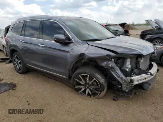 2022 Honda Pilot Touring 7-Passenger with VIN 5FNYF6H6XNB014347, listed as a Copart auction lot 56869745 with 31,513 mi miles and Salvage title. Bid and sale history available at DreamBid. Image 4.
