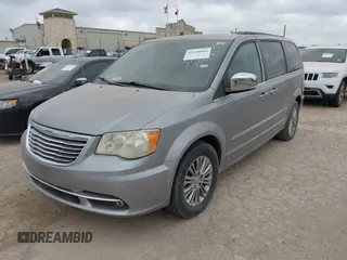 2013 Chrysler Town & Country Touring L with VIN 2C4RC1CG7DR779762, listed as a IAAI auction lot 42118866 with 151,833 mi miles and . Bid and sale history available at DreamBid. Image 2.