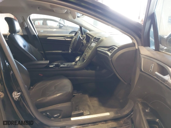 2016 Ford Fusion Titanium Hybrid with VIN 3FA6P0RU7GR127307, listed as a IAAI auction lot 41944427 with 128,076 mi miles. Bid and sale history available at carsss.com. Image 5.