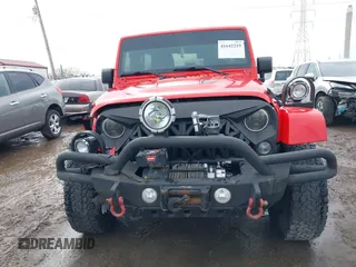 2015 Jeep Wrangler Unlimited Sahara with VIN 1C4BJWEG3FL590491, listed as a IAAI auction lot 41642219 with 148,759 mi miles. Bid and sale history available at carsss.com. Image 11.