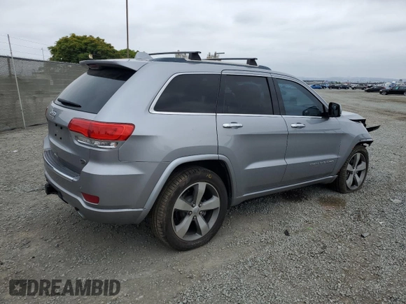 2015 Jeep Grand Cherokee Overland with VIN 1C4RJECG4FC808241, listed as a Copart auction lot 59699685 with 67,542 mi miles and Salvage title. Bid and sale history available at DreamBid. Image 3.