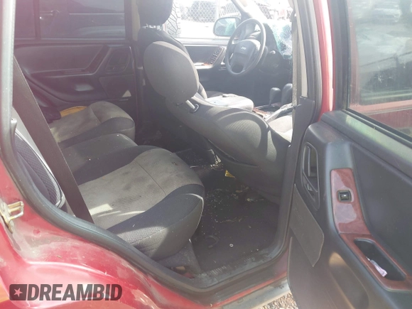 2004 Jeep Grand Cherokee Laredo with VIN 1J4GW48S34C419596, listed as a IAAI auction lot 42515494 with 276,196 mi miles and . Bid and sale history available at DreamBid. Image 8.