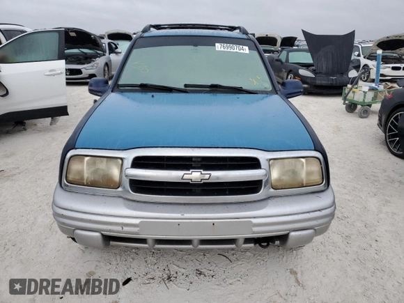 2002 Chevrolet Tracker LT with VIN 2CNBE634126928532, listed as a Copart auction lot 76990704 with Not provided miles and Salvage title. Bid and sale history available at DreamBid. Image 5.