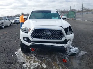 2019 Toyota Tacoma SR z VIN 3TMCZ5AN9KM284092, wystawiony jako IAAI lot #41774851 z przebiegiem 100 031 mil mil oraz . Historia ofert i sprzedaży dostępna na DreamBid. Obrazek 12.