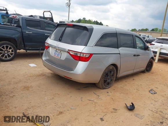 2013 Honda Odyssey LX with VIN 5FNRL5H27DB075559, listed as a IAAI auction lot 42007141 with Not Provided miles and . Bid and sale history available at carsss.com. Image 4.