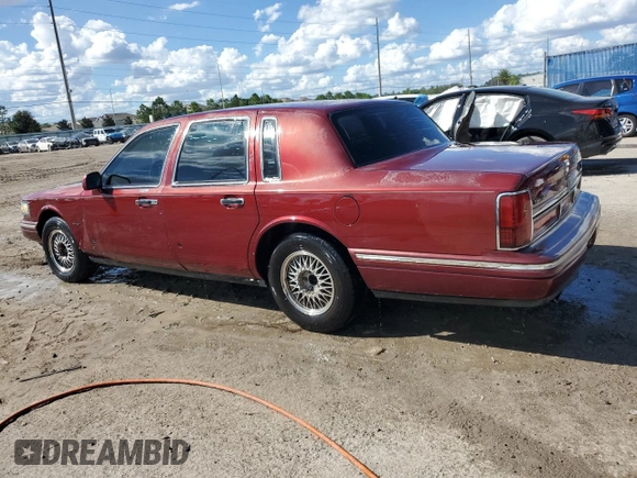 1996 Lincoln Town Car Signature z VIN 1LNLM82W3TY725921, wystawiony jako Copart lot #72569054 z przebiegiem 109 073 mil mil oraz Szkoda całkowita • Salvage title. Historia ofert i sprzedaży dostępna na DreamBid. Obrazek 2.