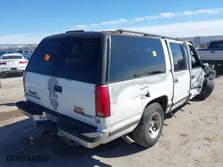 1996 GMC Suburban with VIN 1GDEC16R8TJ738647, listed as a IAAI auction lot 41688543 with 216,078 mi miles. Bid and sale history available at carsss.com. Image 4.