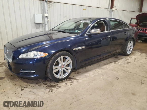 2014 Jaguar XJ Portfolio with VIN SAJWJ2GD7E8V67473, listed as a Copart auction lot 43968705 with 99,146 mi miles and Salvage title. Bid and sale history available at DreamBid. Image 1.