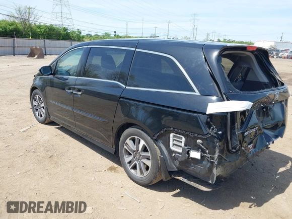 2014 Honda Odyssey Touring with VIN 5FNRL5H94EB079518, listed as a IAAI auction lot 42095098 with 141,019 mi miles and . Bid and sale history available at DreamBid. Image 3.