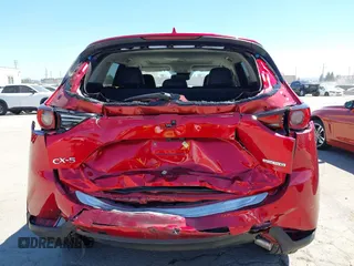 2021 Mazda CX-5 Grand Touring with VIN JM3KFADM5M0470483, listed as a IAAI auction lot 42785031 with 30,749 mi miles and . Bid and sale history available at DreamBid. Image 6.